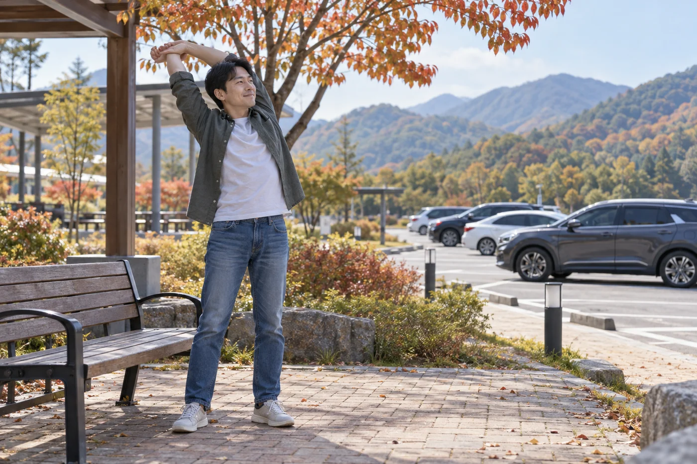 휴게소의 보행 공간에서 차를 세워두고 몸을 푸는 운전자 예시